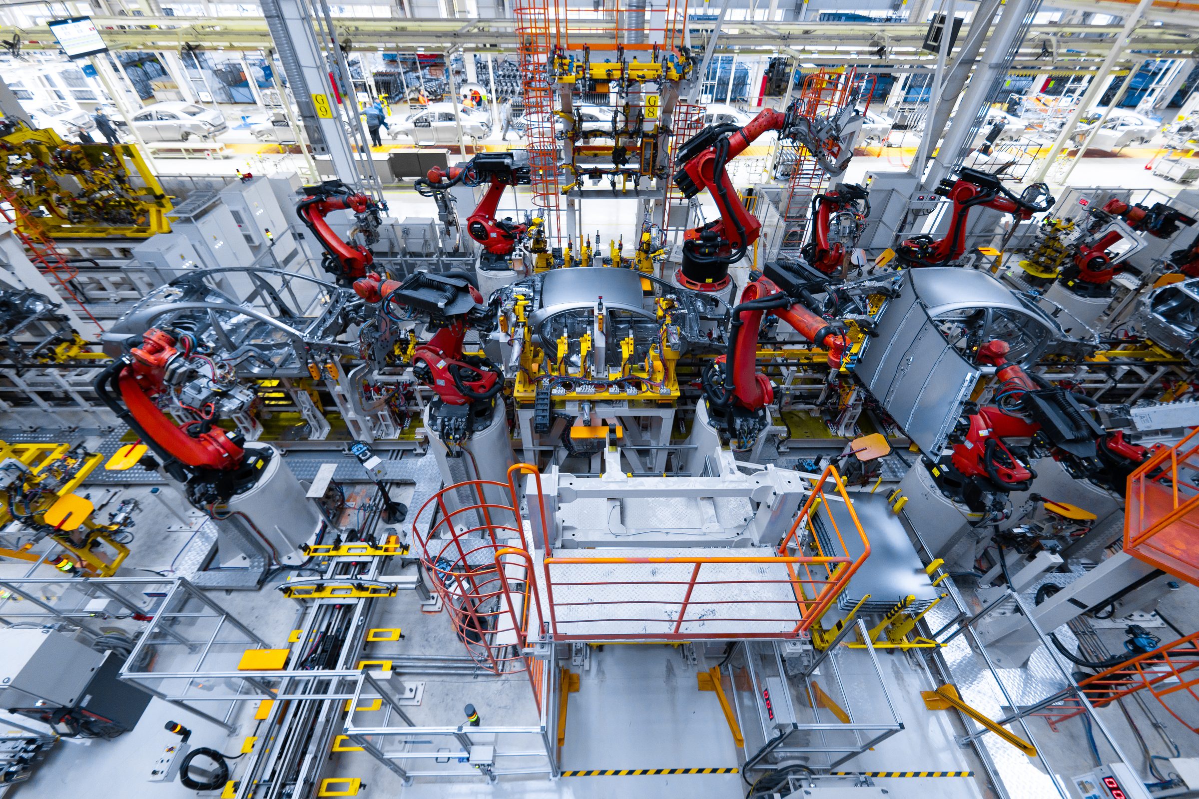 Robotic welding cells on an automated production line